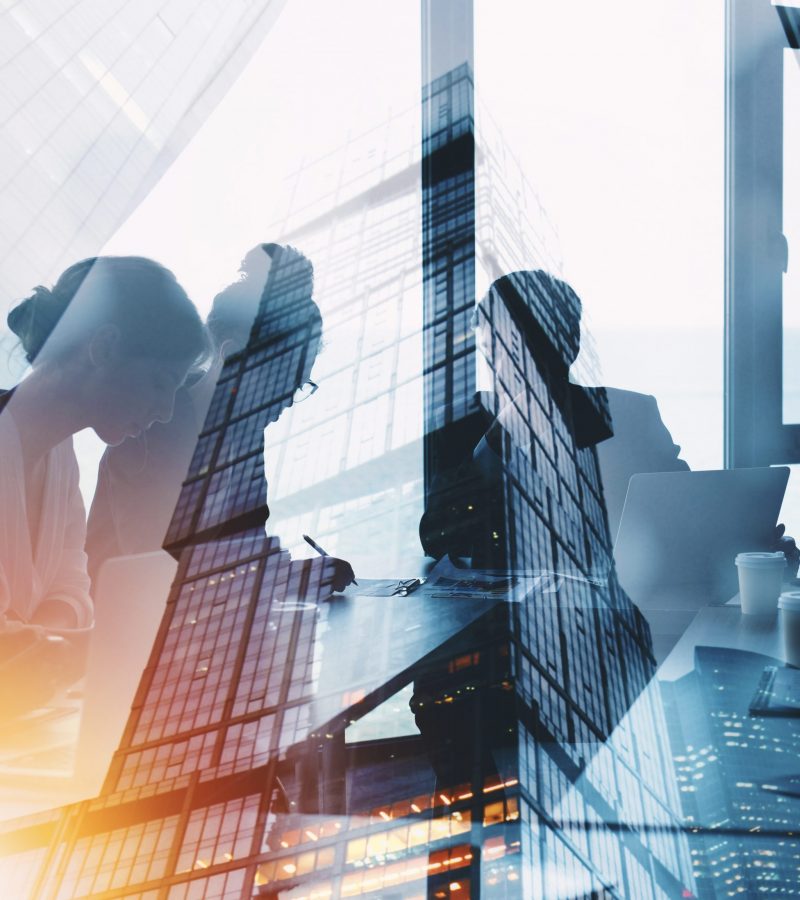 Business people collaborate together in office. Double exposure effects